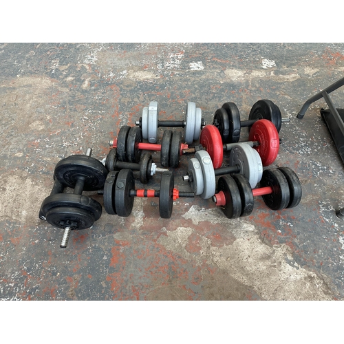 867 - A collection of dumbbells and weights