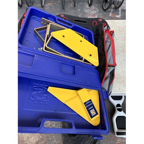 868 - Two items, one pair of Fiama wheel chocks and one cased Stronghold Security Products wheel clamp