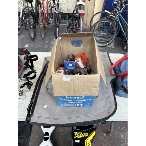 870 - Two items, one bike cover and one box containing bicycle accessories to include innertubes, repair t... 