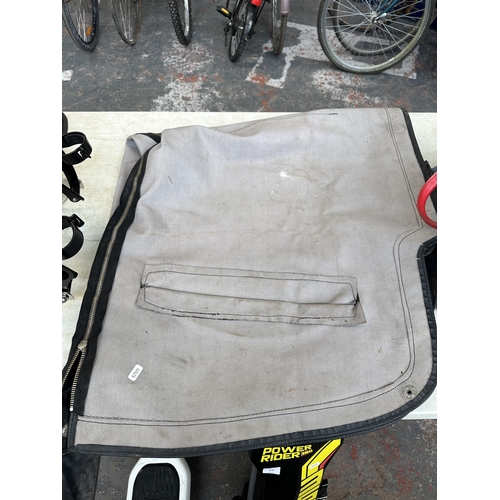 870 - Two items, one bike cover and one box containing bicycle accessories to include innertubes, repair t... 