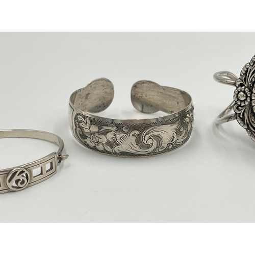 2036 - Four silver and white metal bangles to include hallmarked Edinburgh, Continental .835 etc.