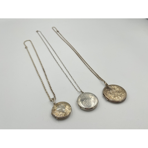 2042 - Three hallmarked sterling silver locket pendant necklaces, two Birmingham and one Sheffield - approx... 