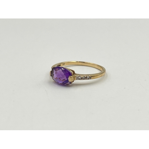 2048 - A 9ct gold diamond and amethyst ring, size M - approx. gross weight 1.42g