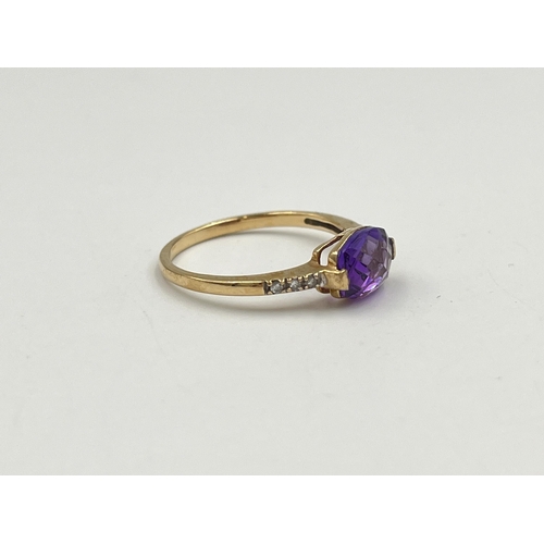 2048 - A 9ct gold diamond and amethyst ring, size M - approx. gross weight 1.42g