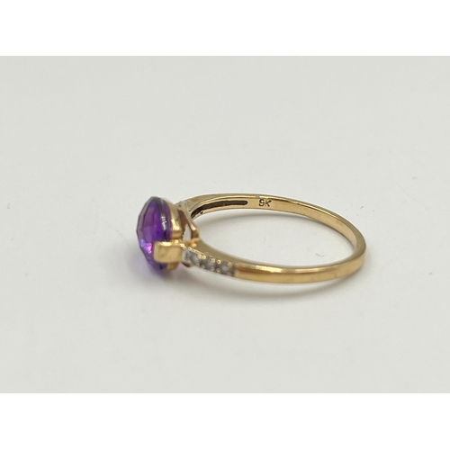 2048 - A 9ct gold diamond and amethyst ring, size M - approx. gross weight 1.42g