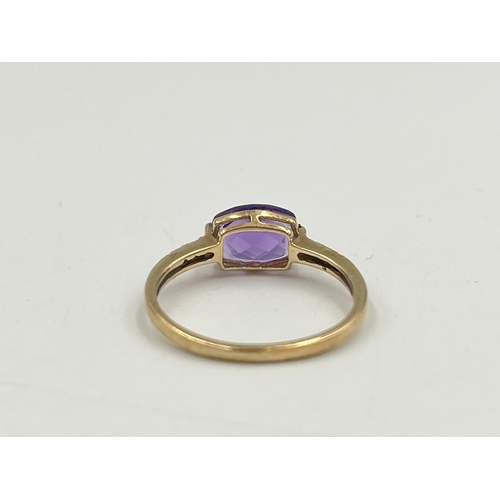 2048 - A 9ct gold diamond and amethyst ring, size M - approx. gross weight 1.42g