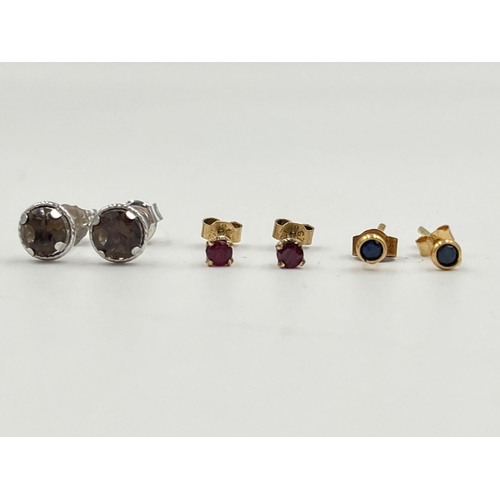 2049 - Three pairs of 9ct gold gemstone set stud earrings, one ruby, one smoky quartz and one sapphire - ap... 