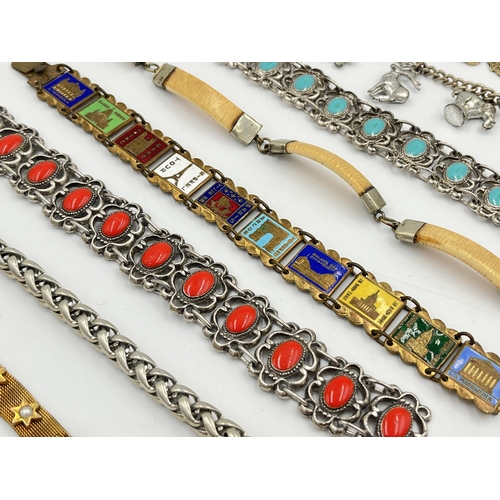 2061 - A collection of bracelets to include white metal, bone, enamel etc.