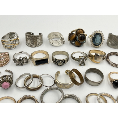 2062 - A collection of dress rings to include white metal, silver plated etc.