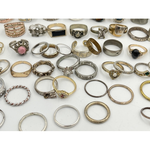 2062 - A collection of dress rings to include white metal, silver plated etc.