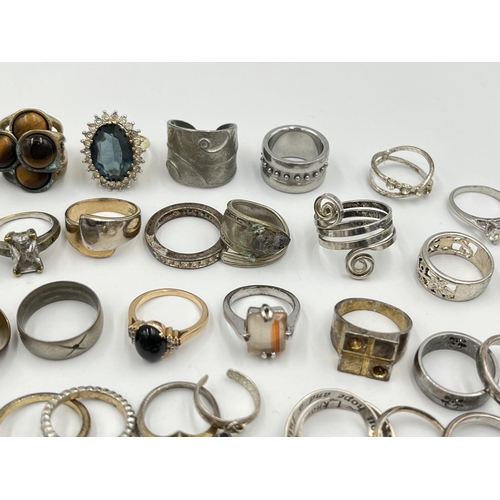 2062 - A collection of dress rings to include white metal, silver plated etc.