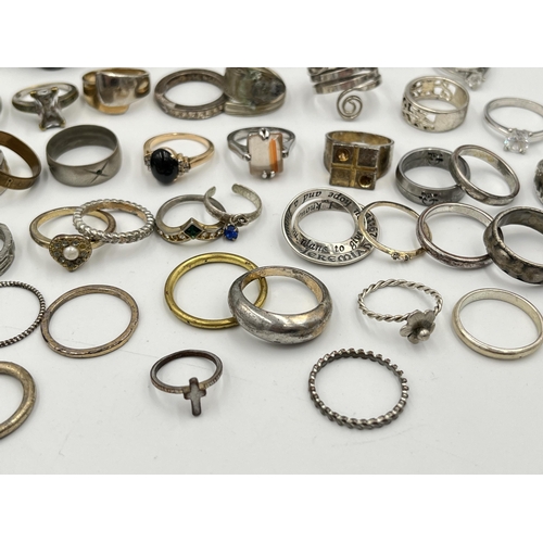 2062 - A collection of dress rings to include white metal, silver plated etc.