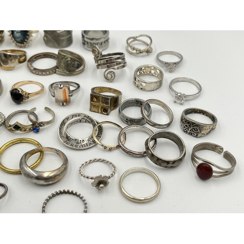 2062 - A collection of dress rings to include white metal, silver plated etc.