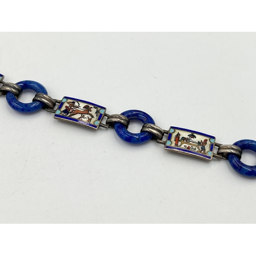 2072 - An Art Deco Egyptian revival silver, guilloche enamel and blue glass bracelet