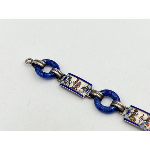 2072 - An Art Deco Egyptian revival silver, guilloche enamel and blue glass bracelet