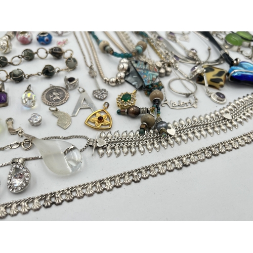 2082 - A large collection of .925 silver and white metal jewellery to include pendants, necklaces bangles, ... 