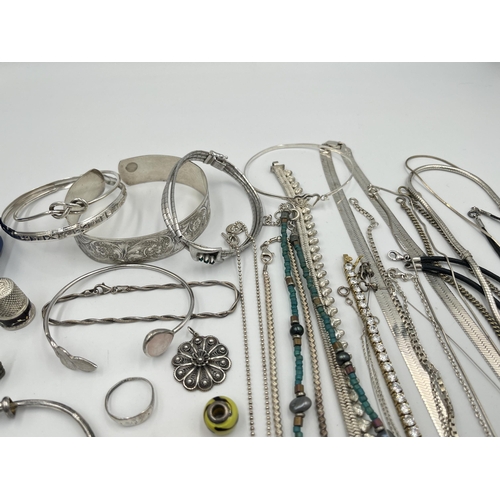 2082 - A large collection of .925 silver and white metal jewellery to include pendants, necklaces bangles, ... 