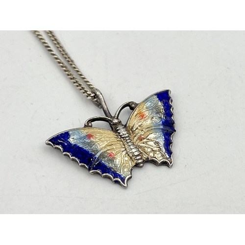 2084 - A guilloche enamel and white metal butterfly pendant on .925 silver chain