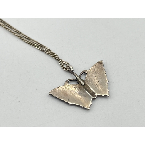 2084 - A guilloche enamel and white metal butterfly pendant on .925 silver chain