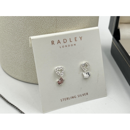 2085A - Four pieces of .925 silver and white metal jewellery, two pairs of boxed Radley earrings, one red co... 