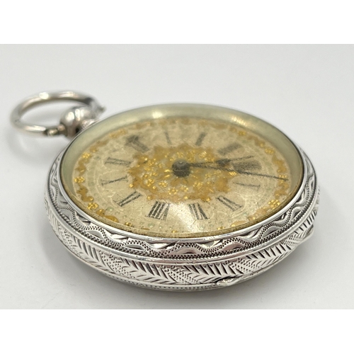 2091 - A Victorian hallmarked Birmingham silver cased open face key wind pocket watch, dated 1883 with gilt... 