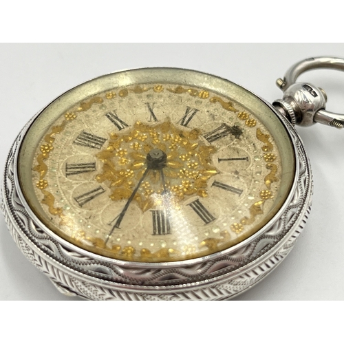 2091 - A Victorian hallmarked Birmingham silver cased open face key wind pocket watch, dated 1883 with gilt... 