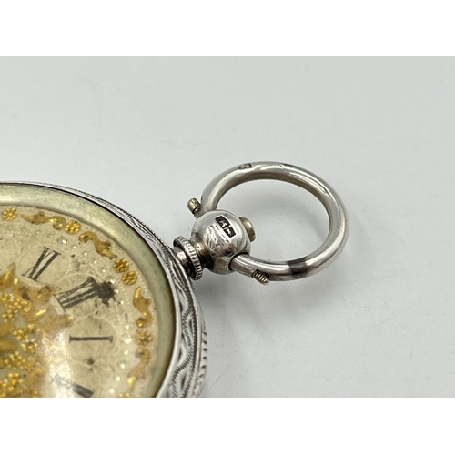 2091 - A Victorian hallmarked Birmingham silver cased open face key wind pocket watch, dated 1883 with gilt... 