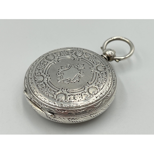 2091 - A Victorian hallmarked Birmingham silver cased open face key wind pocket watch, dated 1883 with gilt... 