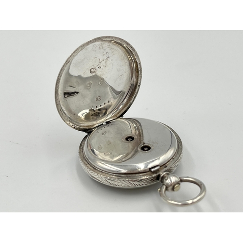 2091 - A Victorian hallmarked Birmingham silver cased open face key wind pocket watch, dated 1883 with gilt... 