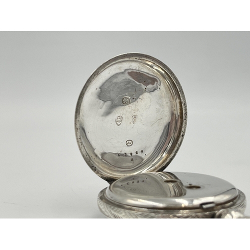 2091 - A Victorian hallmarked Birmingham silver cased open face key wind pocket watch, dated 1883 with gilt... 