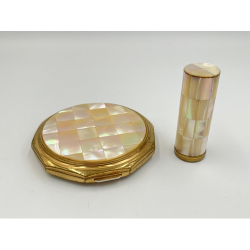 2111 - A mid 20th century boxed Stratton mother of pearl and brass two piece vanity set comprising compact ... 