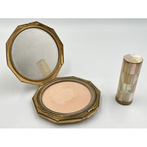 2111 - A mid 20th century boxed Stratton mother of pearl and brass two piece vanity set comprising compact ... 