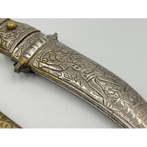 Two Islamic daggers with scabbards, and engraved decoration