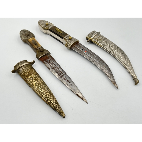 2114A - Two Islamic daggers with scabbards, and engraved decoration