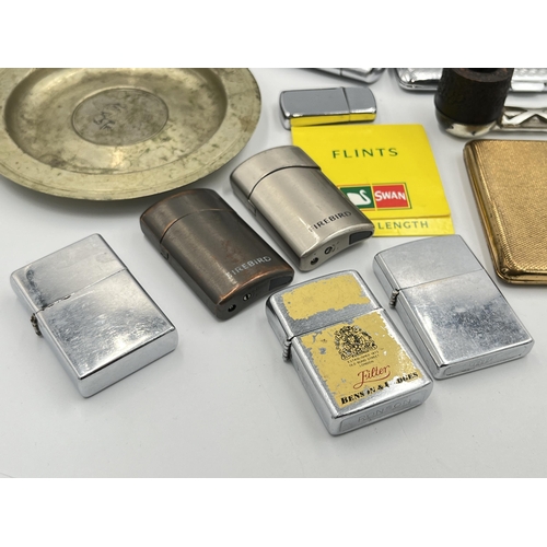 2116 - A collection of tobacciana to include four Zippo lighters, Ronson Benson & Hedges advertising lighte... 