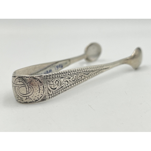 2143 - A pair of Victorian hallmarked Birmingham silver sugar tongs, dated 1894 - approx. gross weight 20g