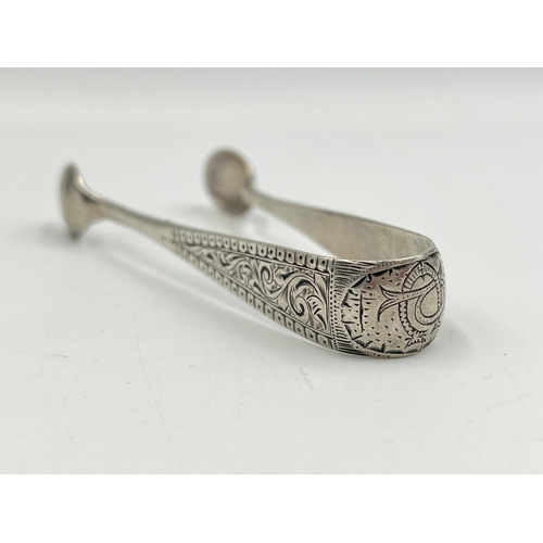 2143 - A pair of Victorian hallmarked Birmingham silver sugar tongs, dated 1894 - approx. gross weight 20g