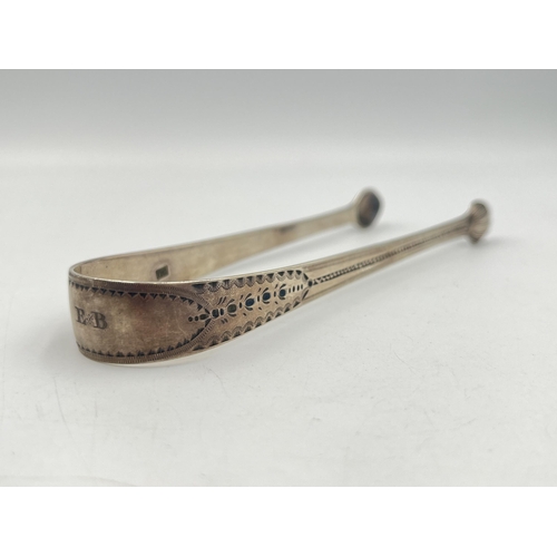 2146 - A pair of George III hallmarked sterling silver sugar tongs - approx. gross weight 34g