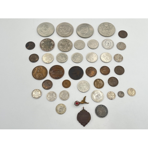 2180 - A collection of worldwide coins to include four silver and five 50% silver, Royal Air Force brass an... 