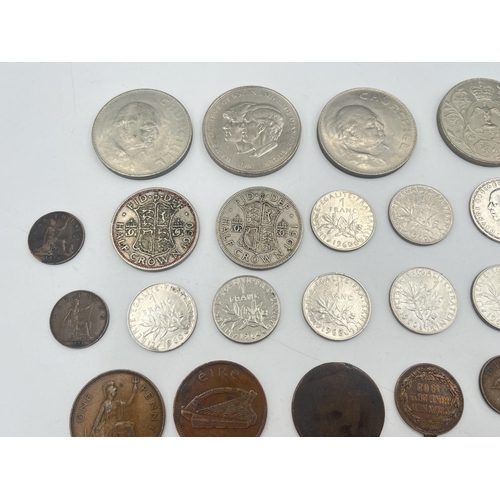 2180 - A collection of worldwide coins to include four silver and five 50% silver, Royal Air Force brass an... 