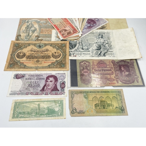 2182 - A collection of worldwide bank notes to include 100, 500 and 5000 Russian Roubles, 1930 100 Hungaria... 