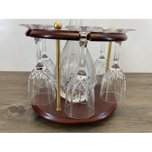 361 - An RCR glass seven piece drinking set on mahogany stand