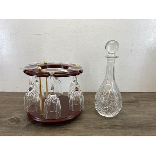 361 - An RCR glass seven piece drinking set on mahogany stand