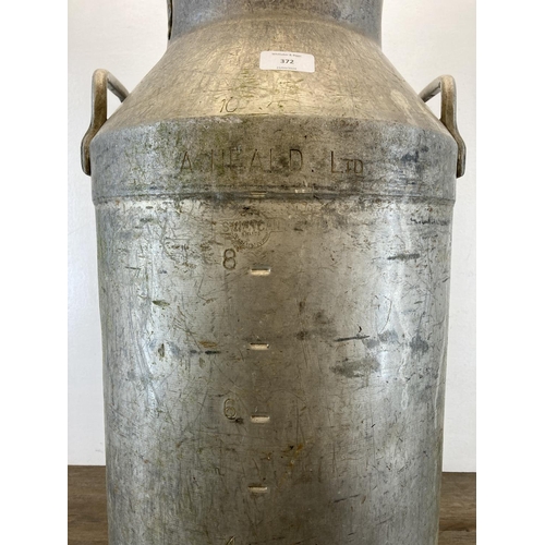 372 - A Swifts of Scarborough Ltd. galvanised milk churn - approx. 71cm high