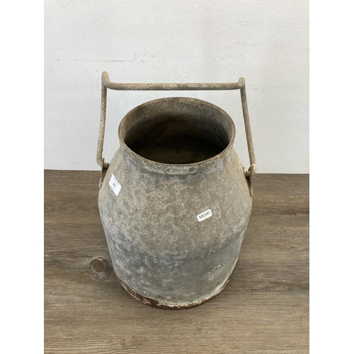 373 - A vintage galvanised milk churn - approx. 38cm high