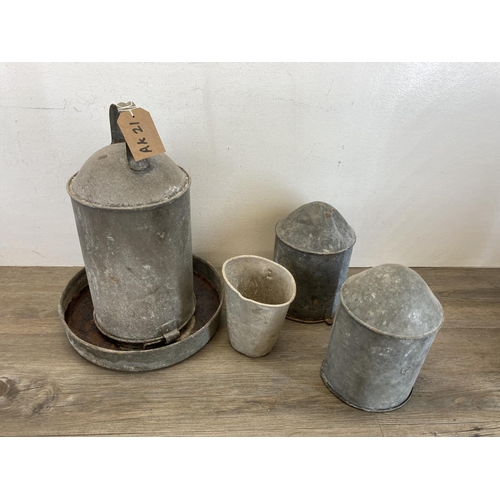 385 - A collection of vintage galvanised items to include chicken feeder, shovels etc.