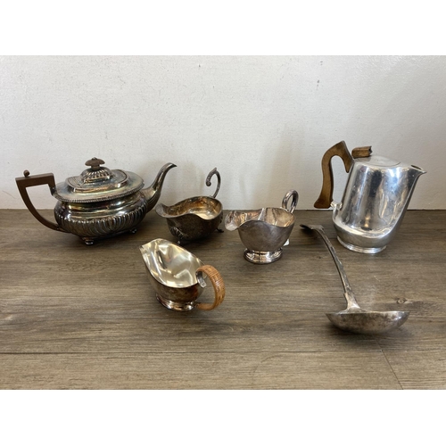 389 - A collection of metalware to include silver plated crumb tray with hallmarked Sheffield silver colla... 