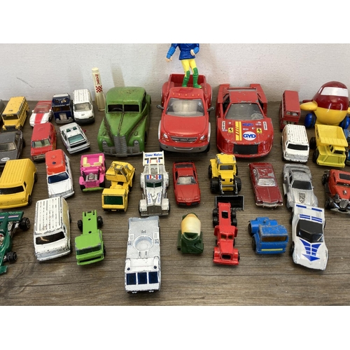 390A - A collection of toys to include Mettoy tinplate clockwork saloon car, Matchbox Audi Quattro, Corgi J... 