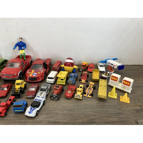 390A - A collection of toys to include Mettoy tinplate clockwork saloon car, Matchbox Audi Quattro, Corgi J... 