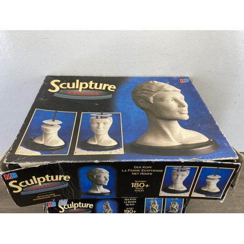 406 - Four boxed MB Sculpture Puzzles 3D vertical jigsaws